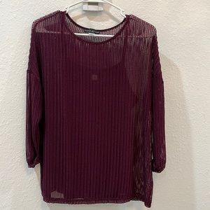 Wine red, netty top with attached wine red camisole.